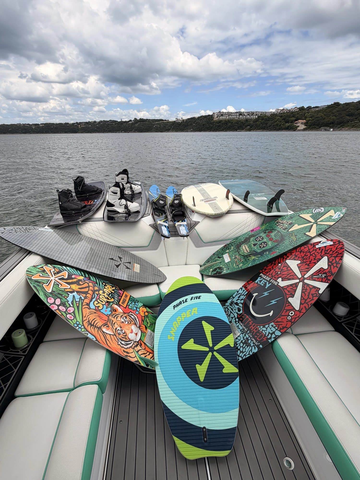 Wakesurf boards laid out on the Nautique's deck.